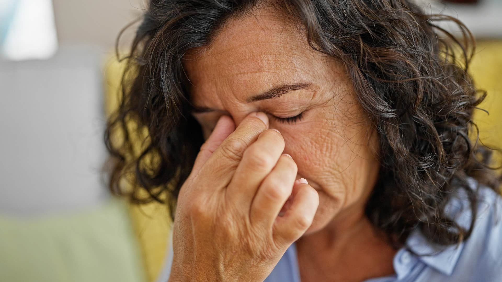 older sad woman who feels disconnected from her kids