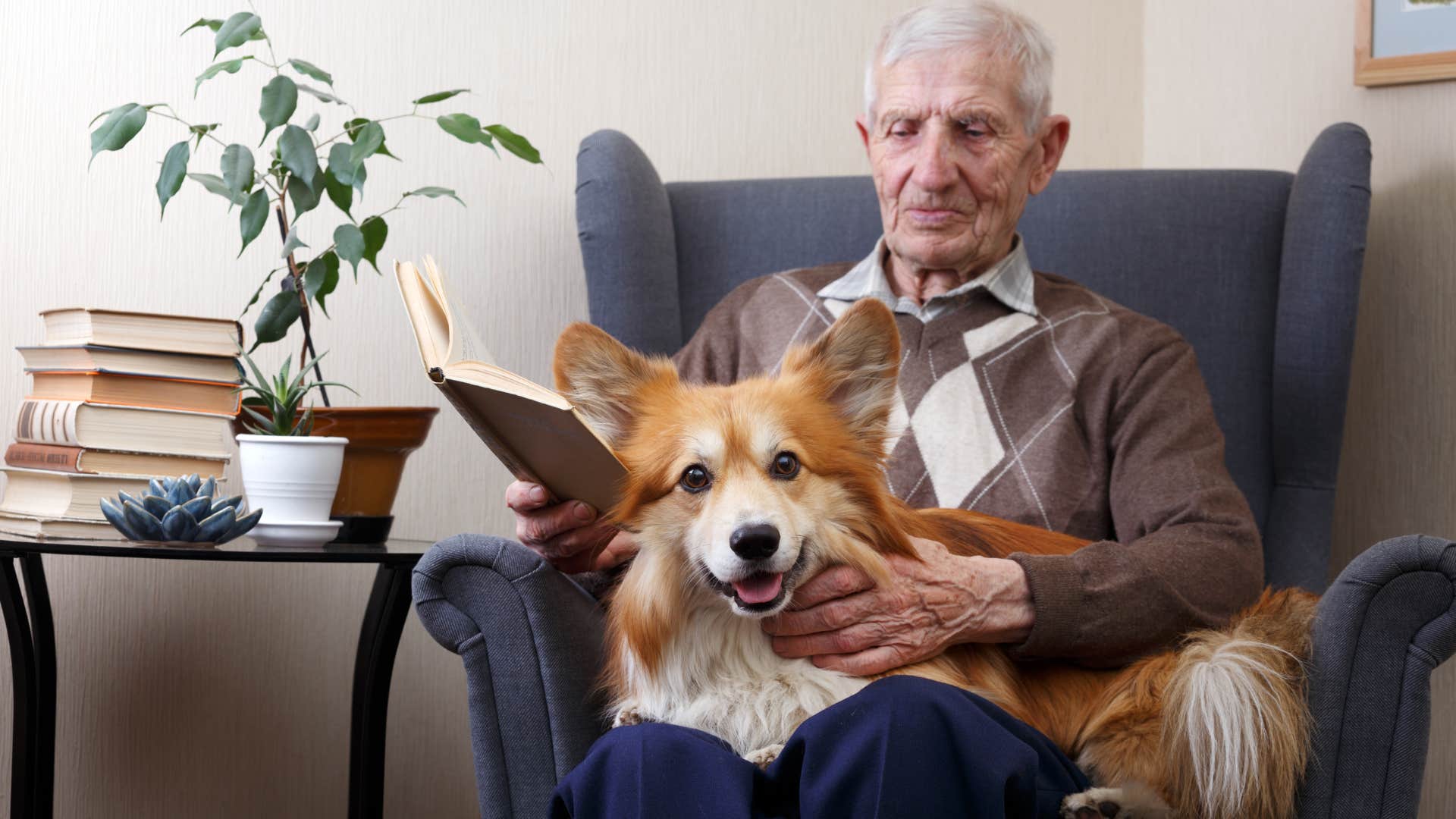 older man sitting with dog who is his closest family member
