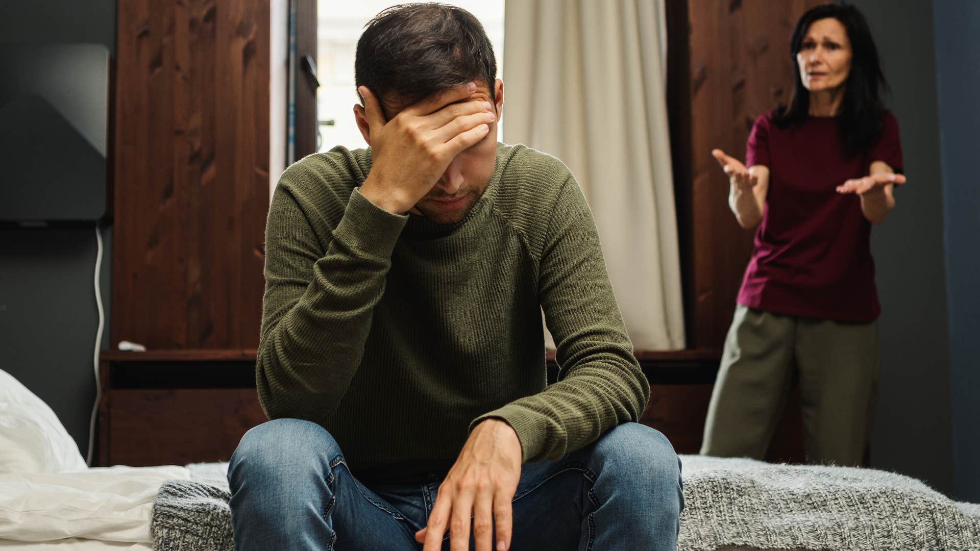 mom yelling at upset adult son saying we don't talk about that in this house
