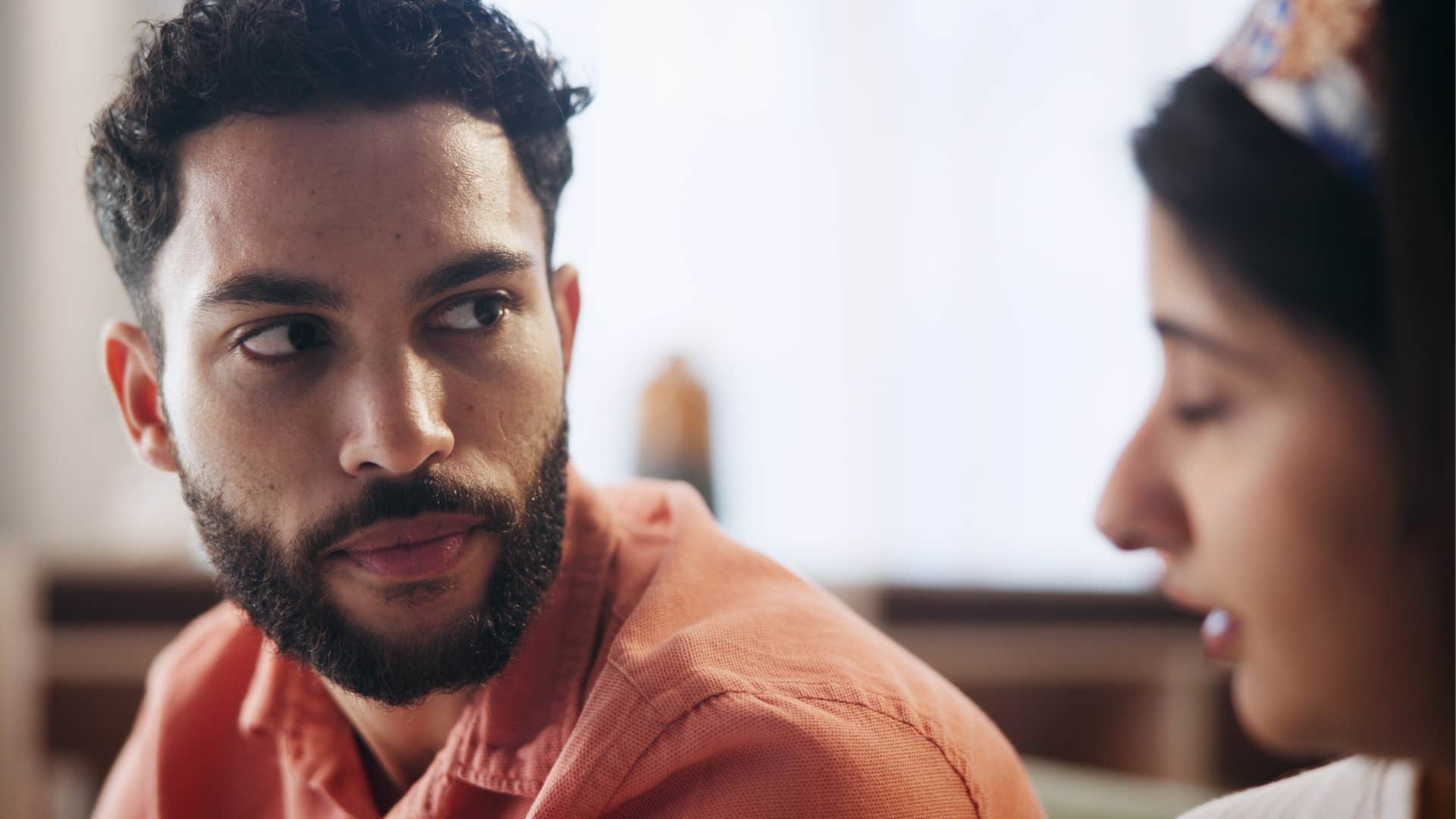 Woman saying "you're completely overreacting" to her upset husband.