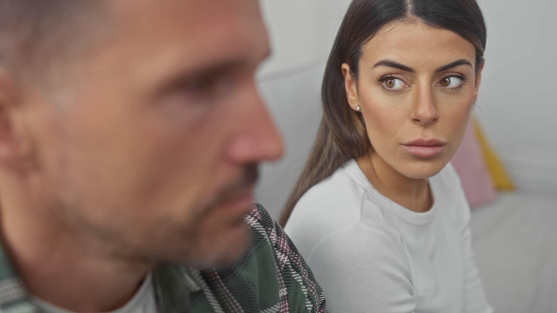 Woman saying "you should know how I feel" to her partner.