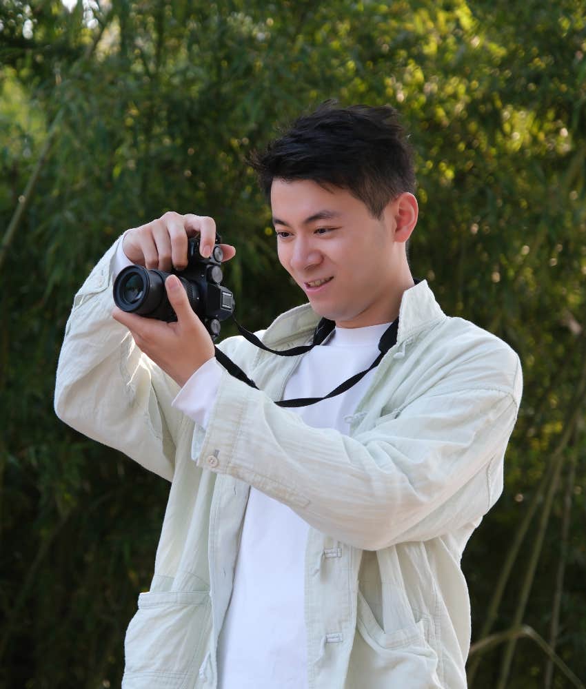 happy man taking pictures