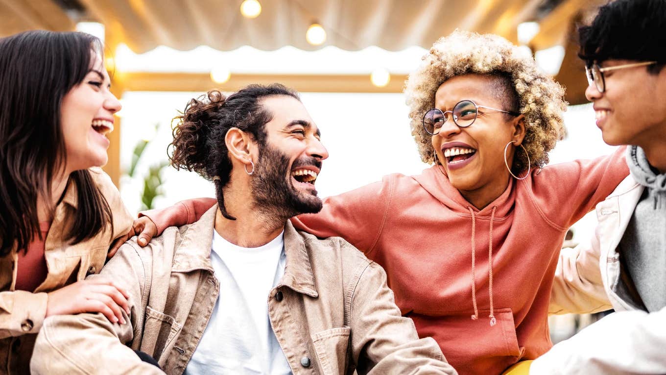 Confident charming person entering a room with magnetic presence showing the habits incredibly charming people use when they walk into a room.