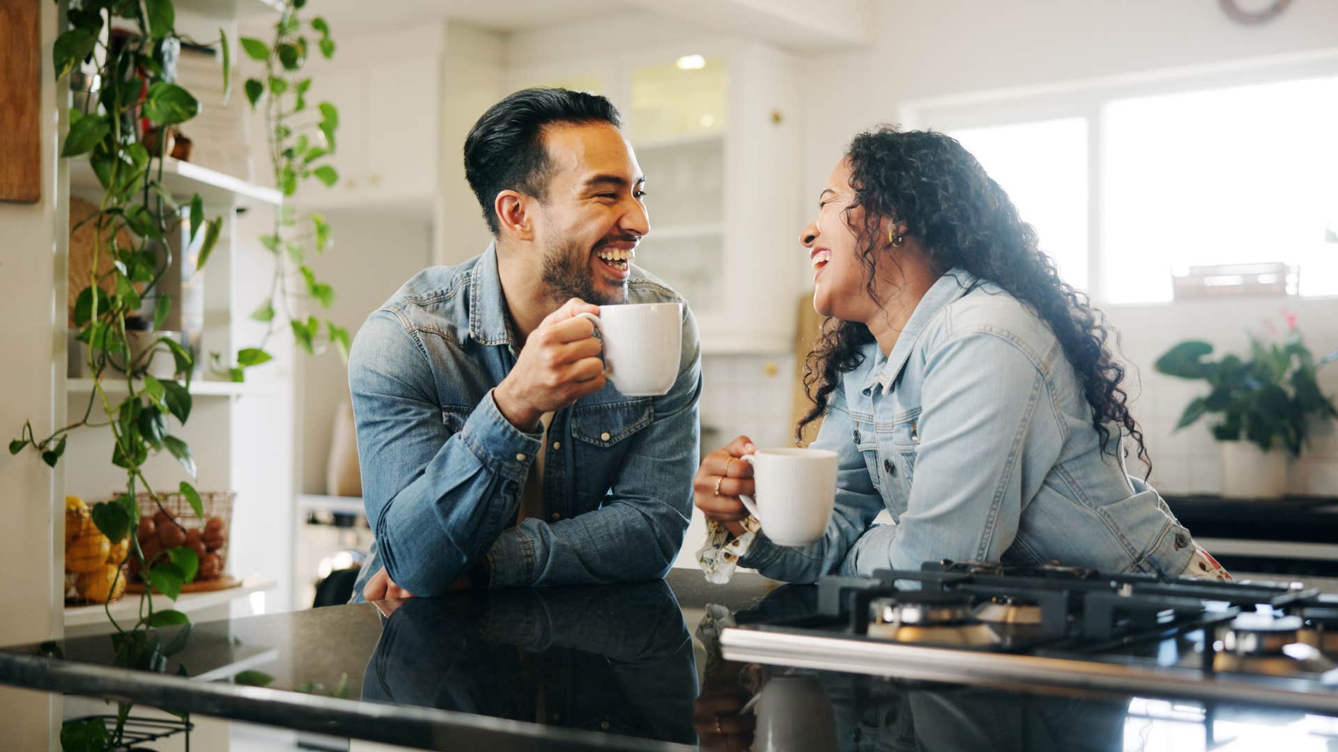 Man laughs with strong woman who understands attraction