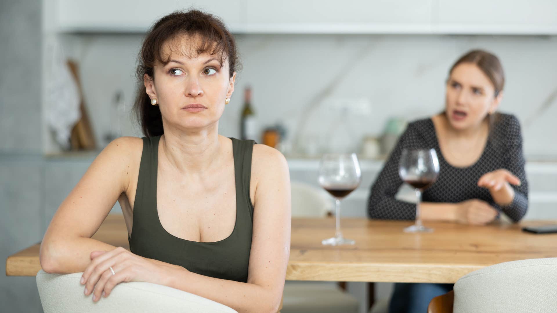 woman refusing to argue with friend ignoring her