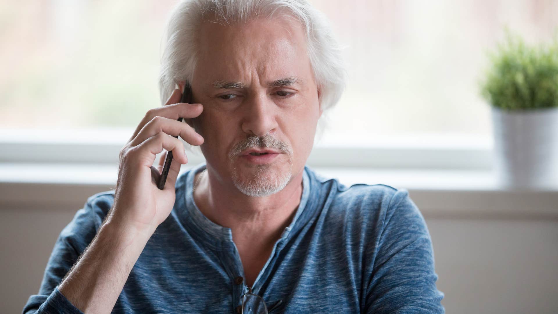 lying man talking on the phone