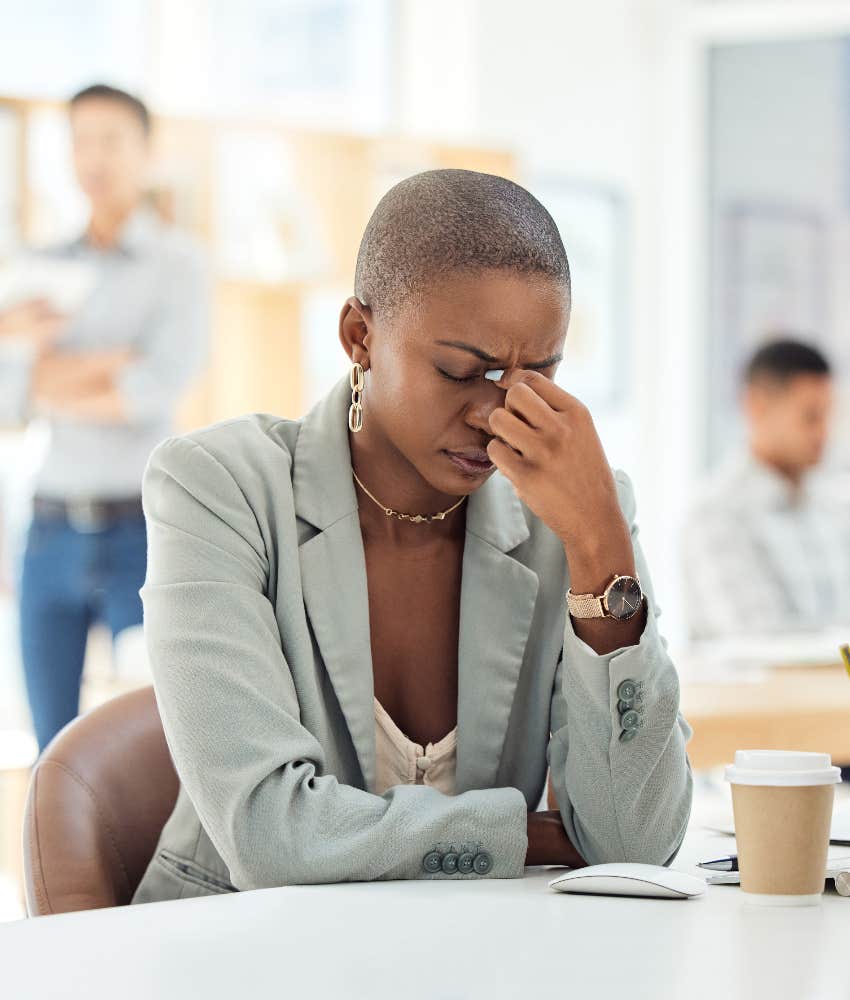 worker stressed at her desk