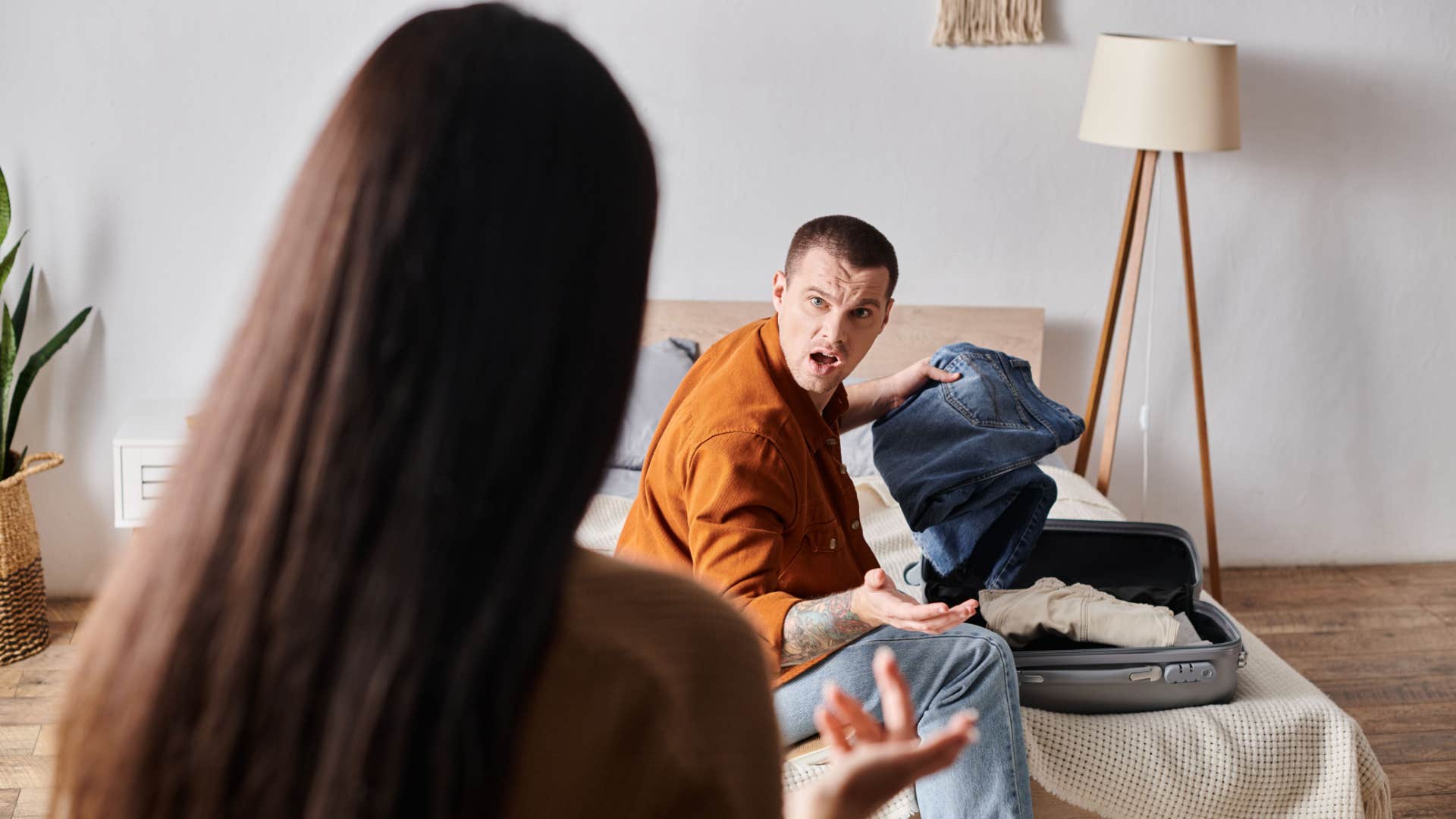 man asking his wife if the jeans fit her anymore