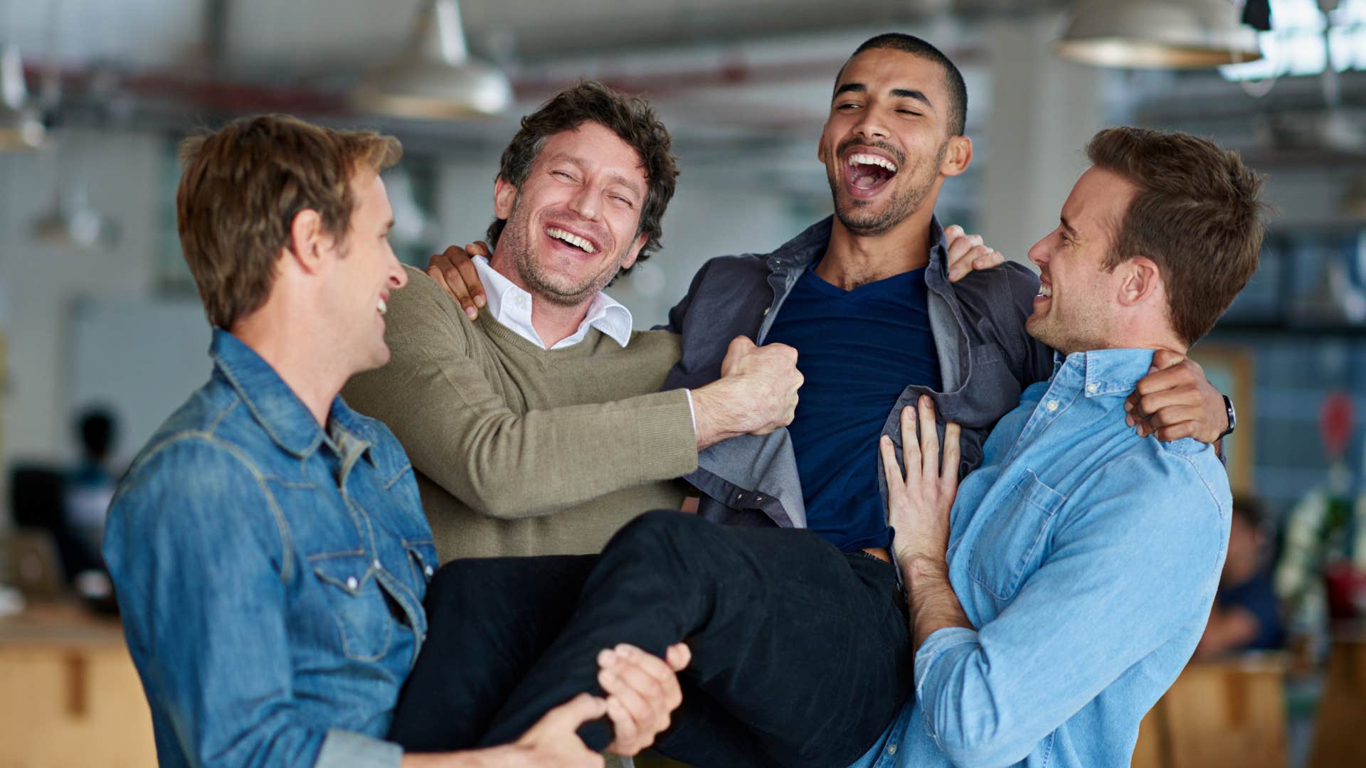 man gossiping with friends about his wife