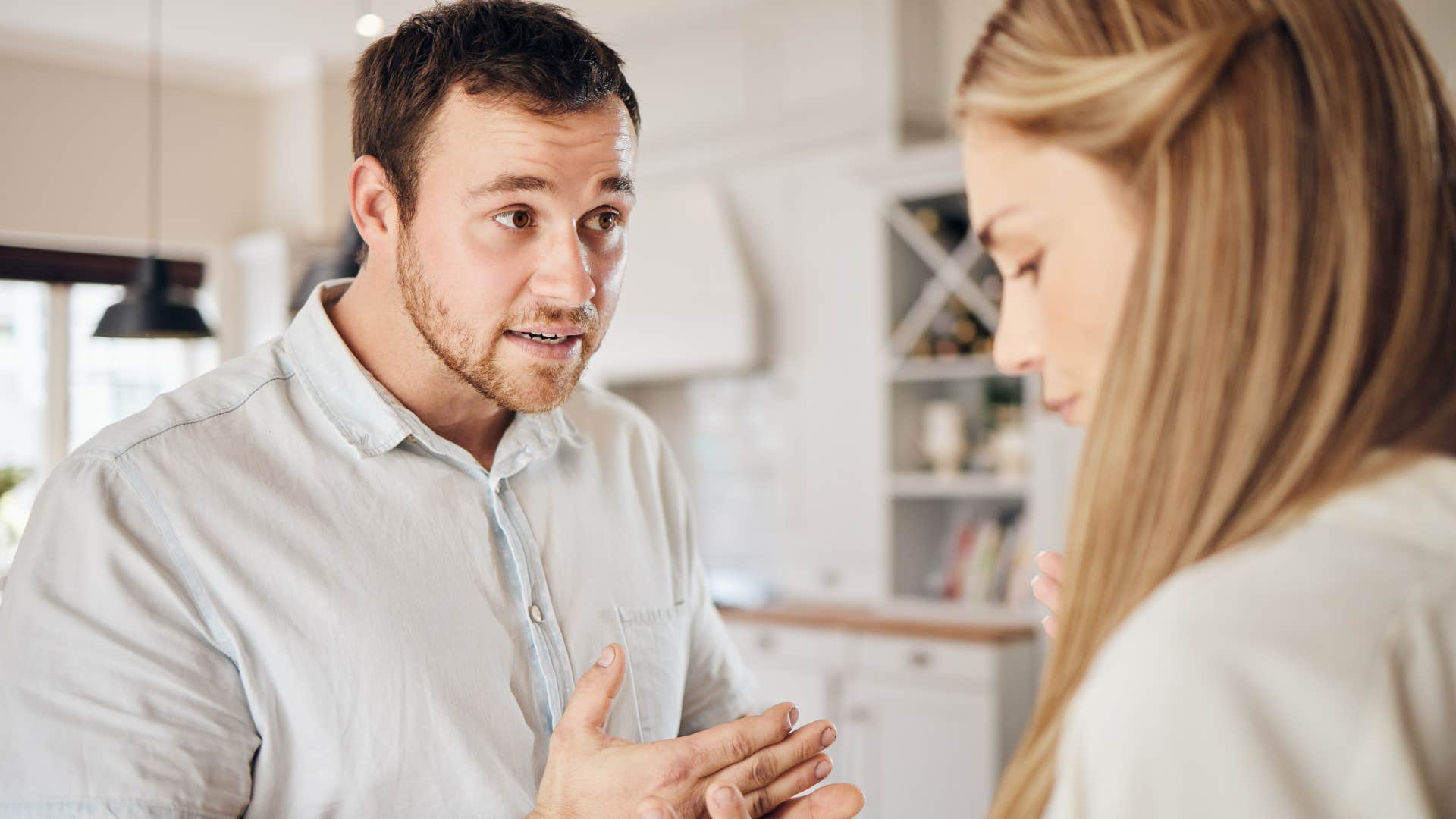 man condescendingly telling wife not to wear something