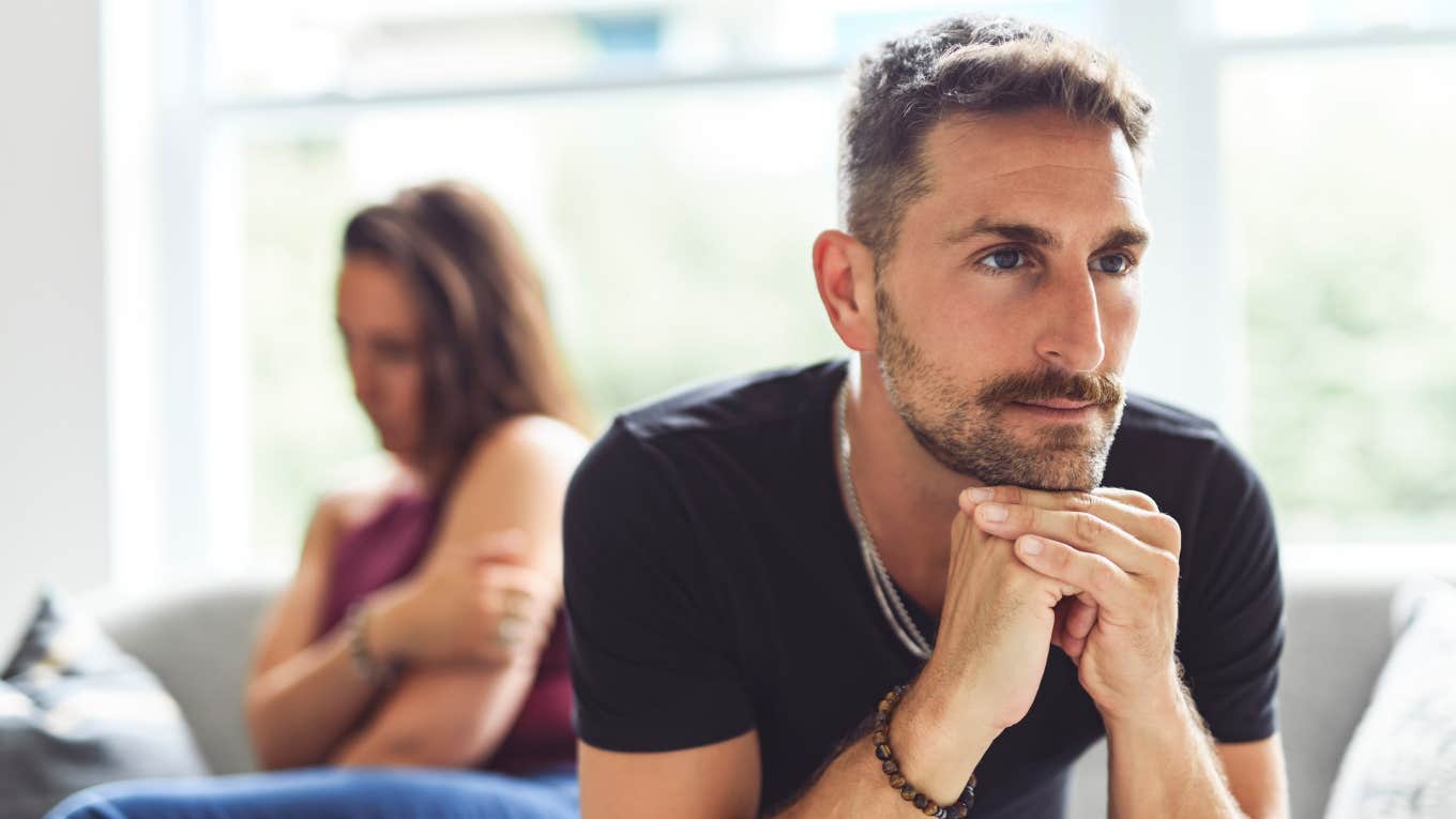 resentful man turned away from successful wife