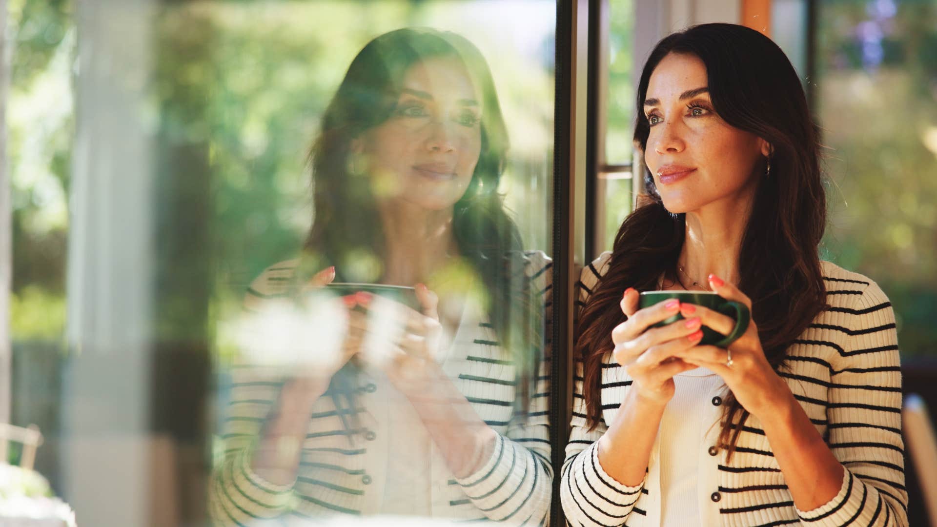 woman using the magical manifestation ritual of drinking bay leaf tea
