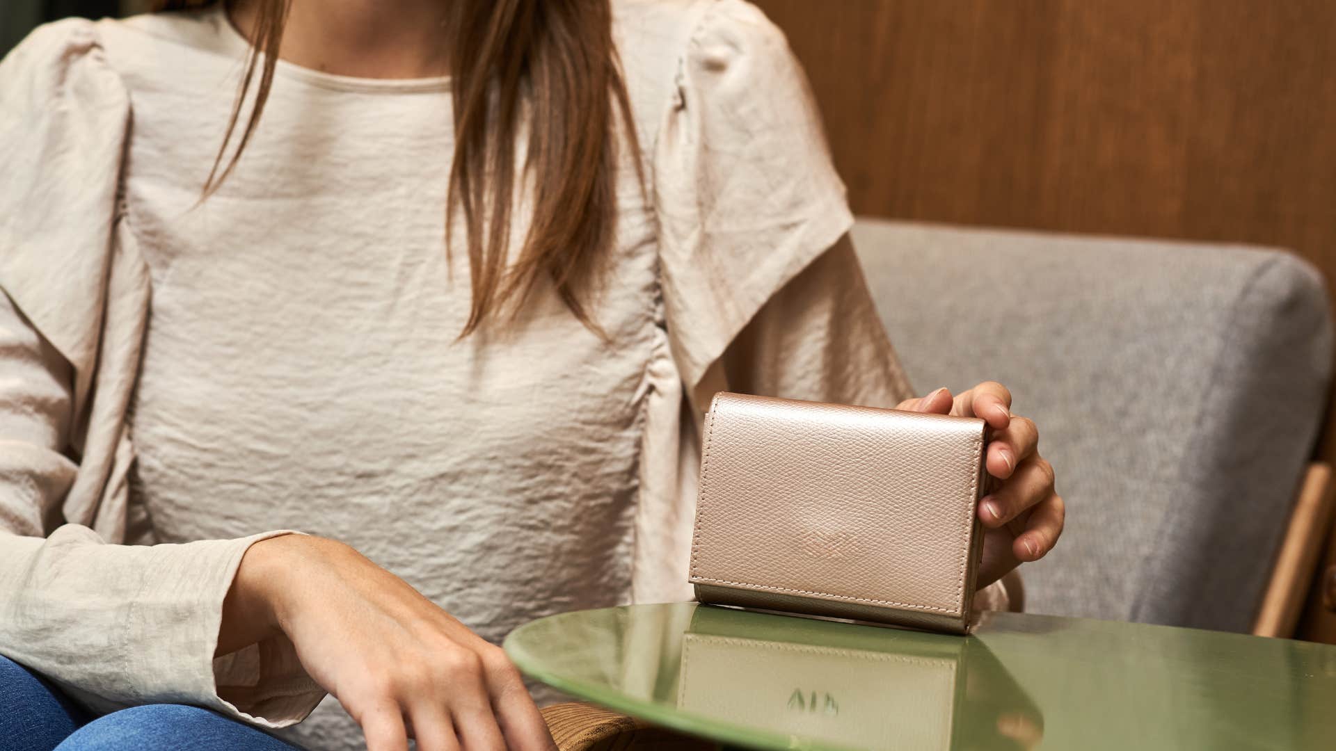 woman doing manifestation ritual of keeping bay leaves in her wallet