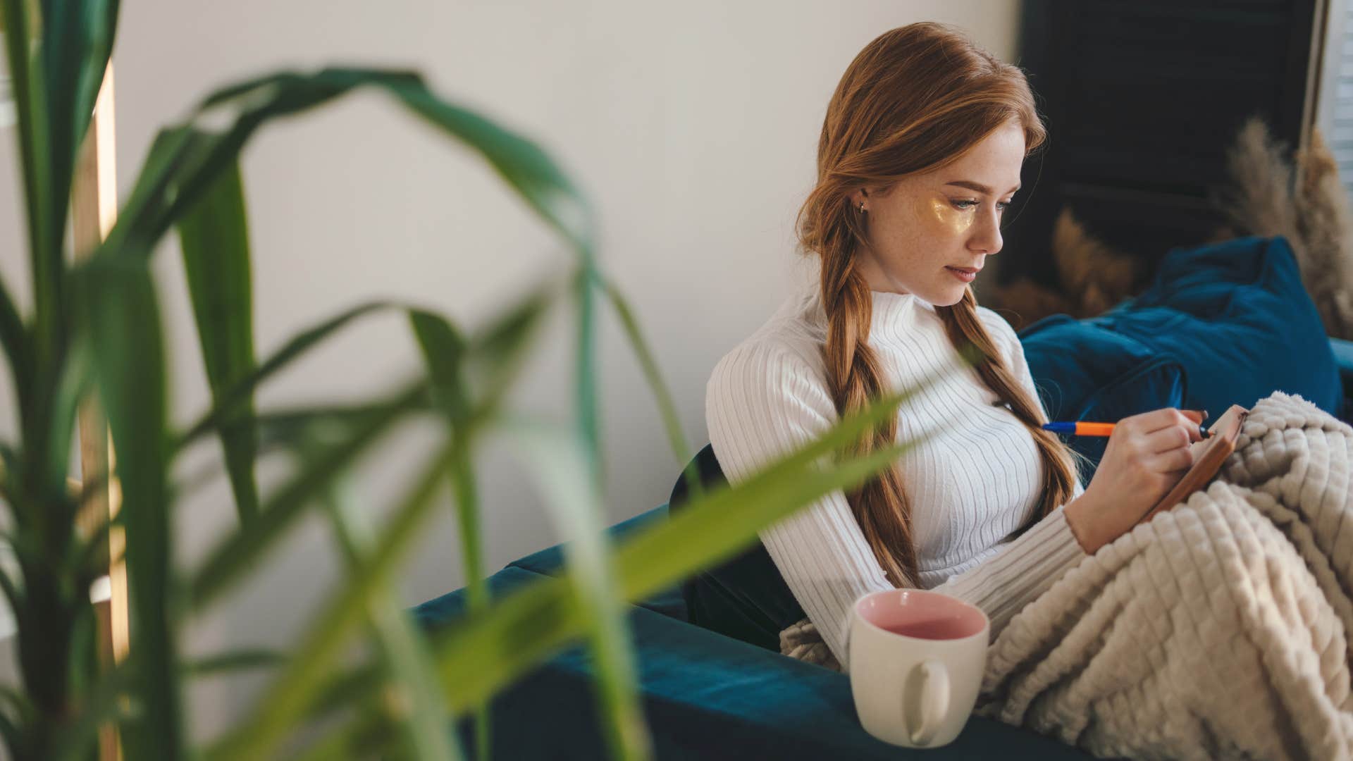 woman using magical manifestation ritual by writing it down