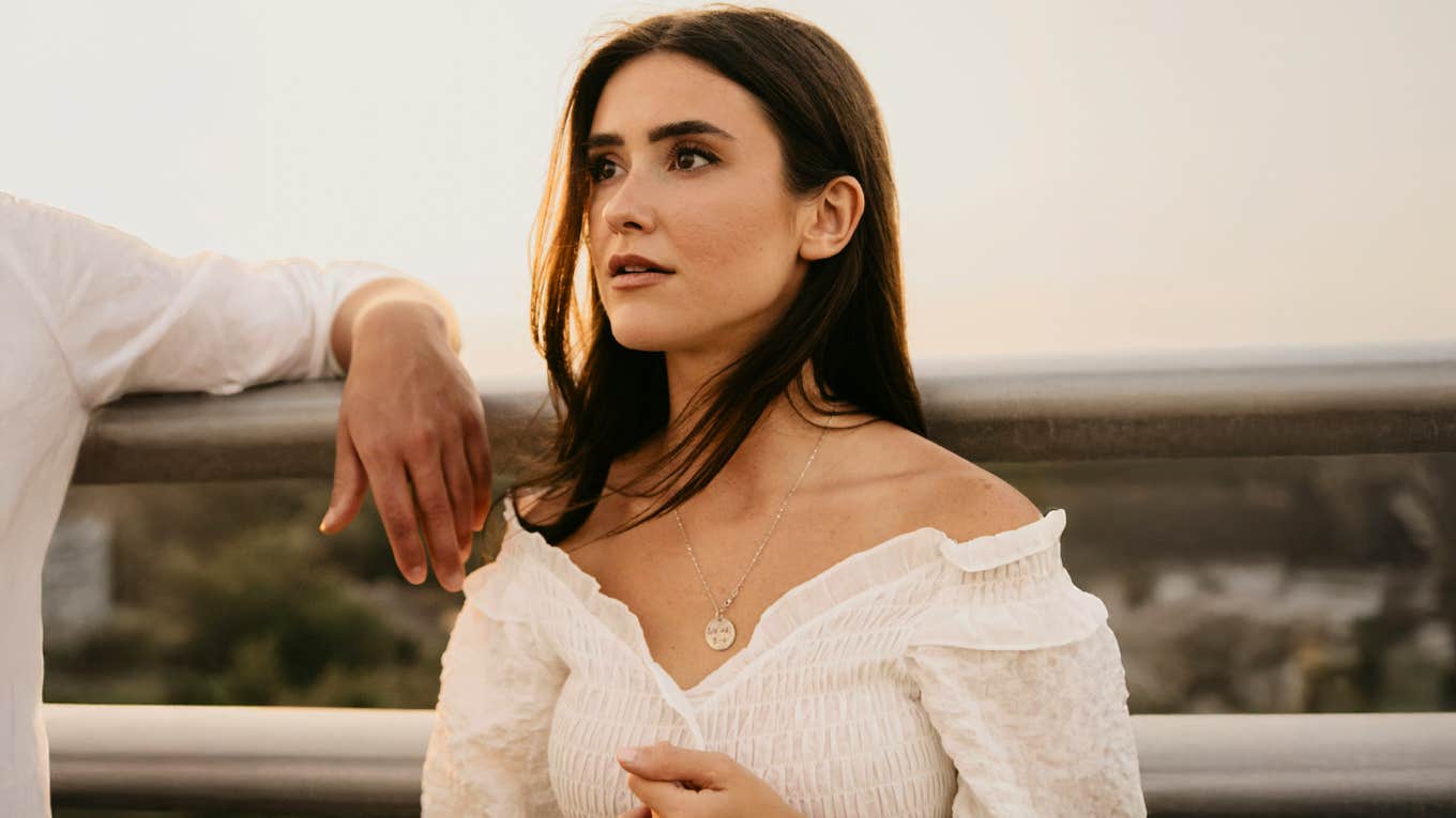 Woman in white dress deep in thought — the haunting truth about what marriage does to those who don’t learn fast enough.