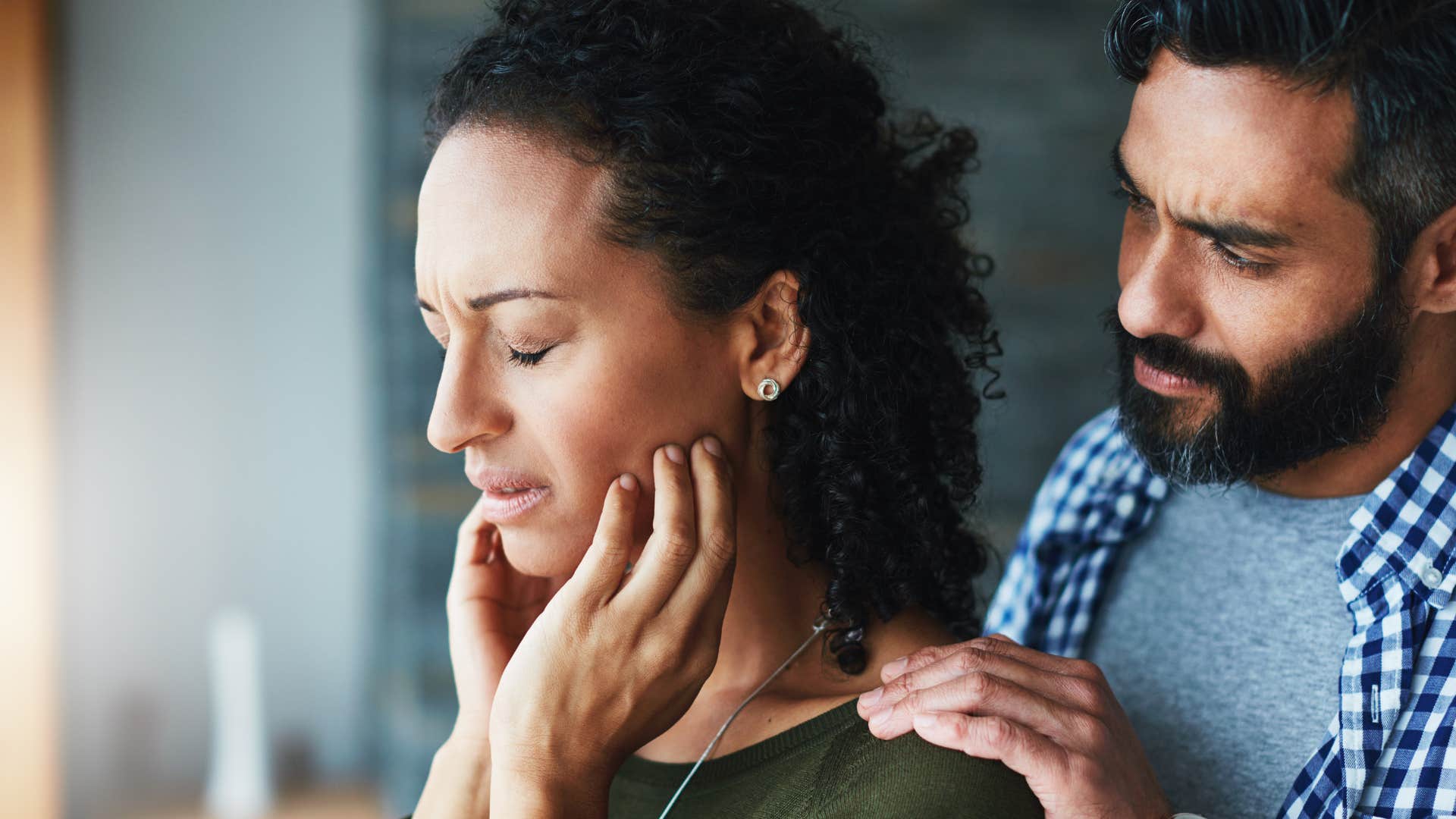 man refusing to defend woman when needed as she looks upset