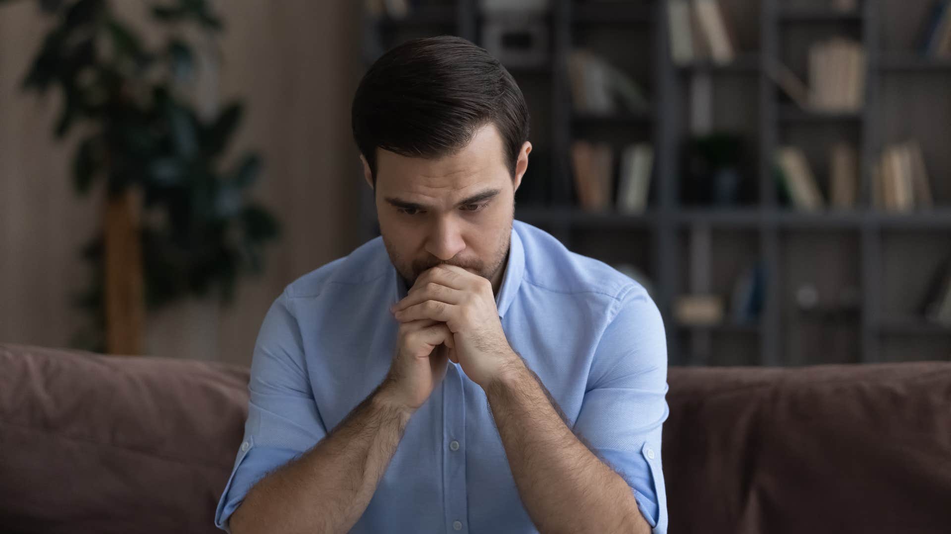 man feeling insecure thinking deeply