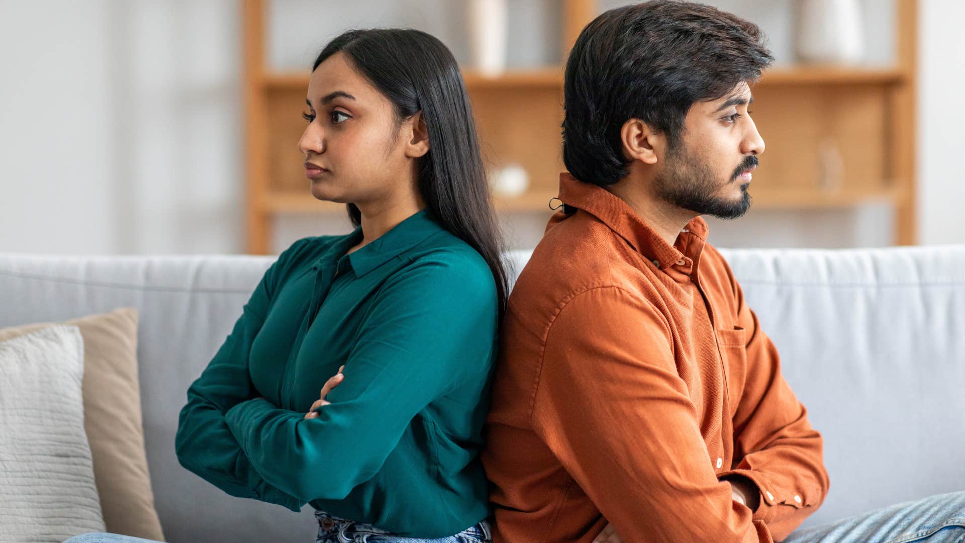 couple turned away from each other avoiding affection