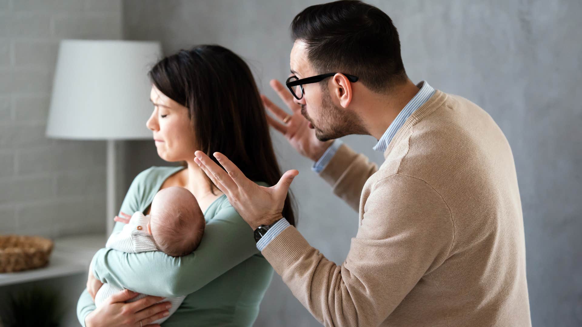 man arguing about parenting choices with his wife
