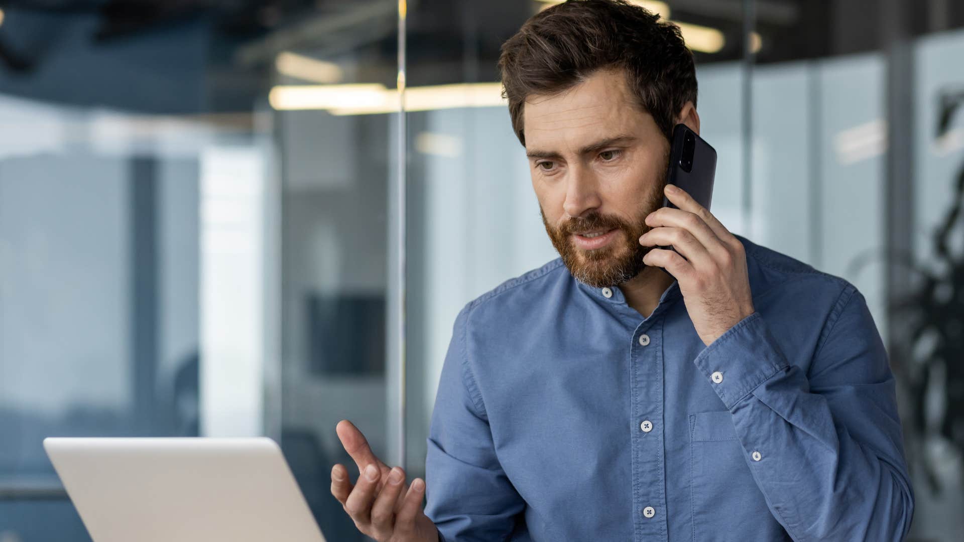 man on the phone trying to fix things