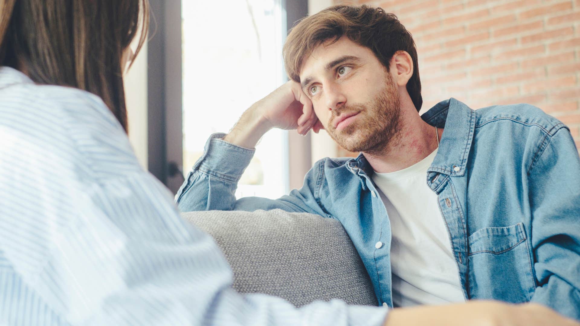 man minimizing his own feelings talking to his partner