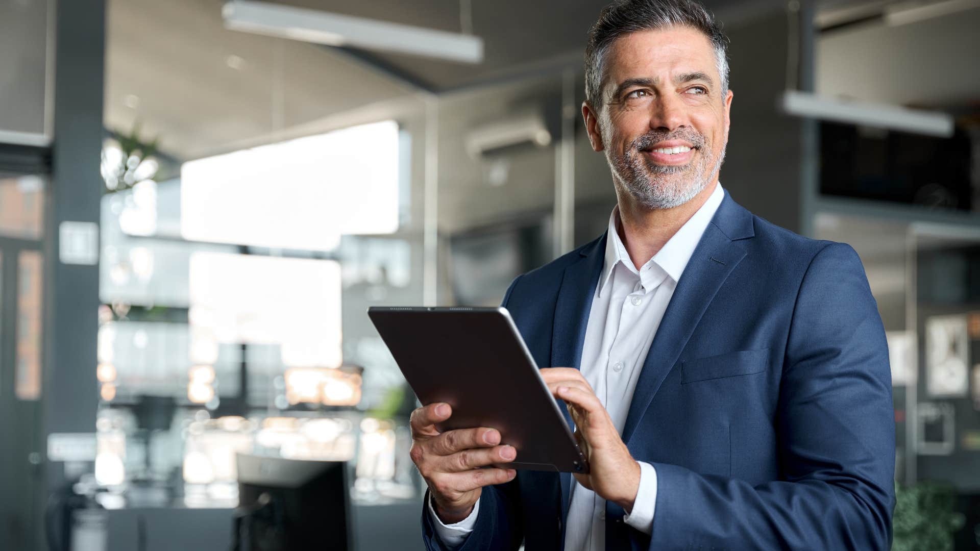businessman in office holding tablet