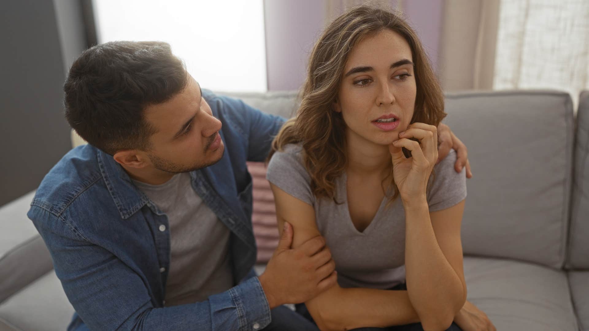 man trying to speak over upset woman's experience