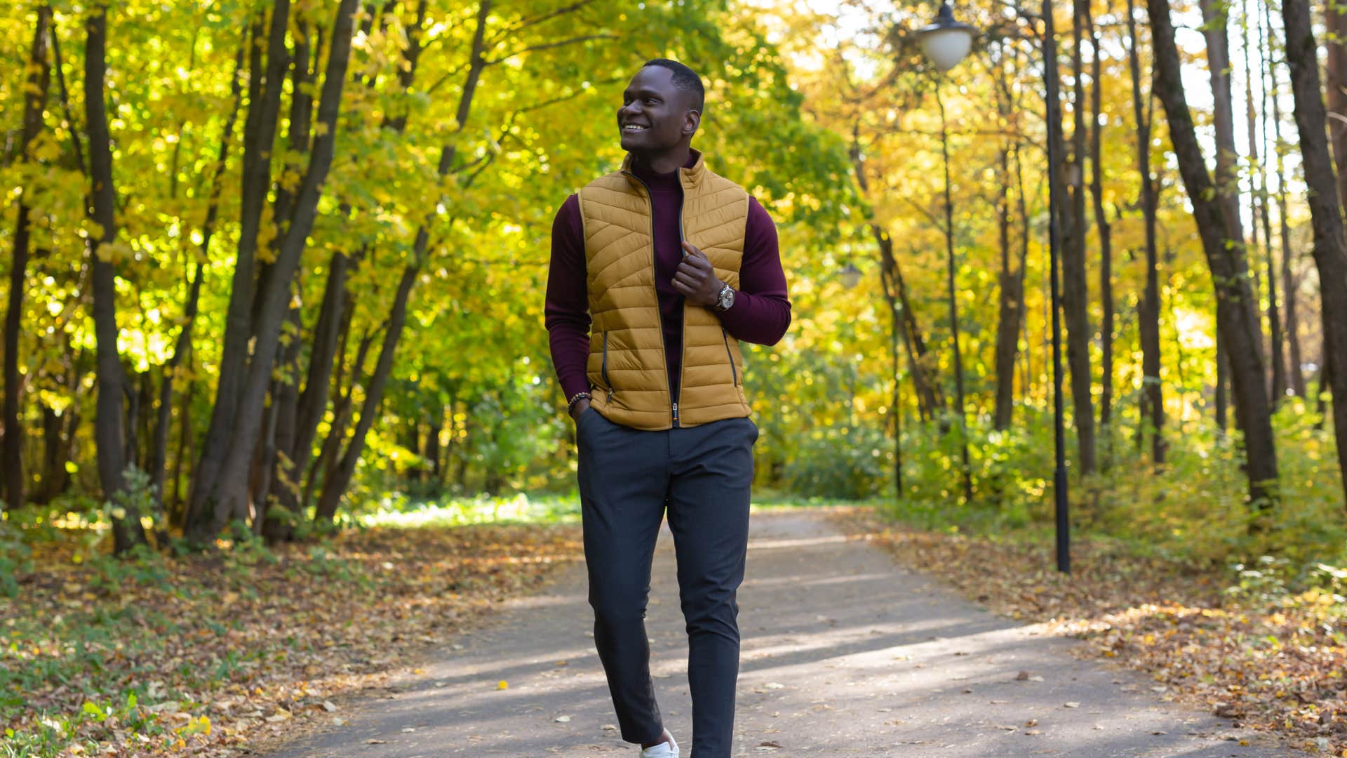 confident man walking alone in the forest