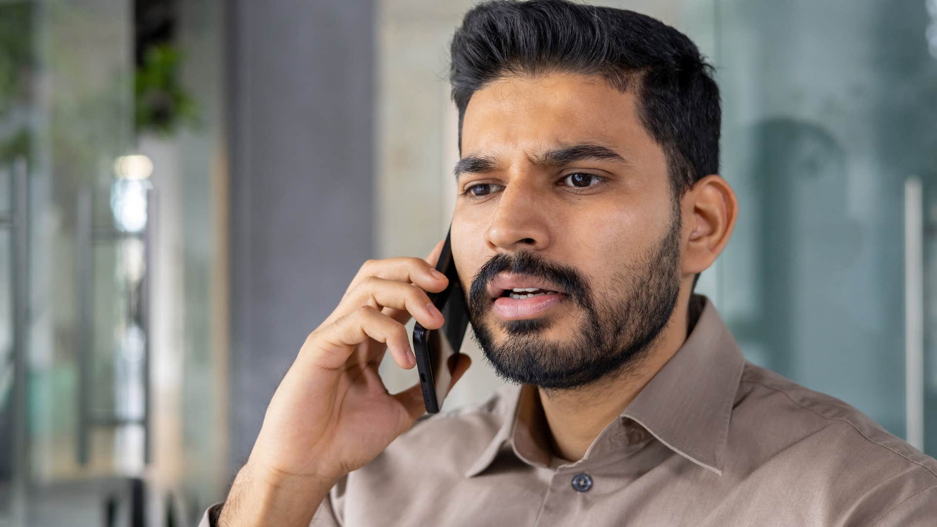 Man saying "I owe it to them to try" on the phone.