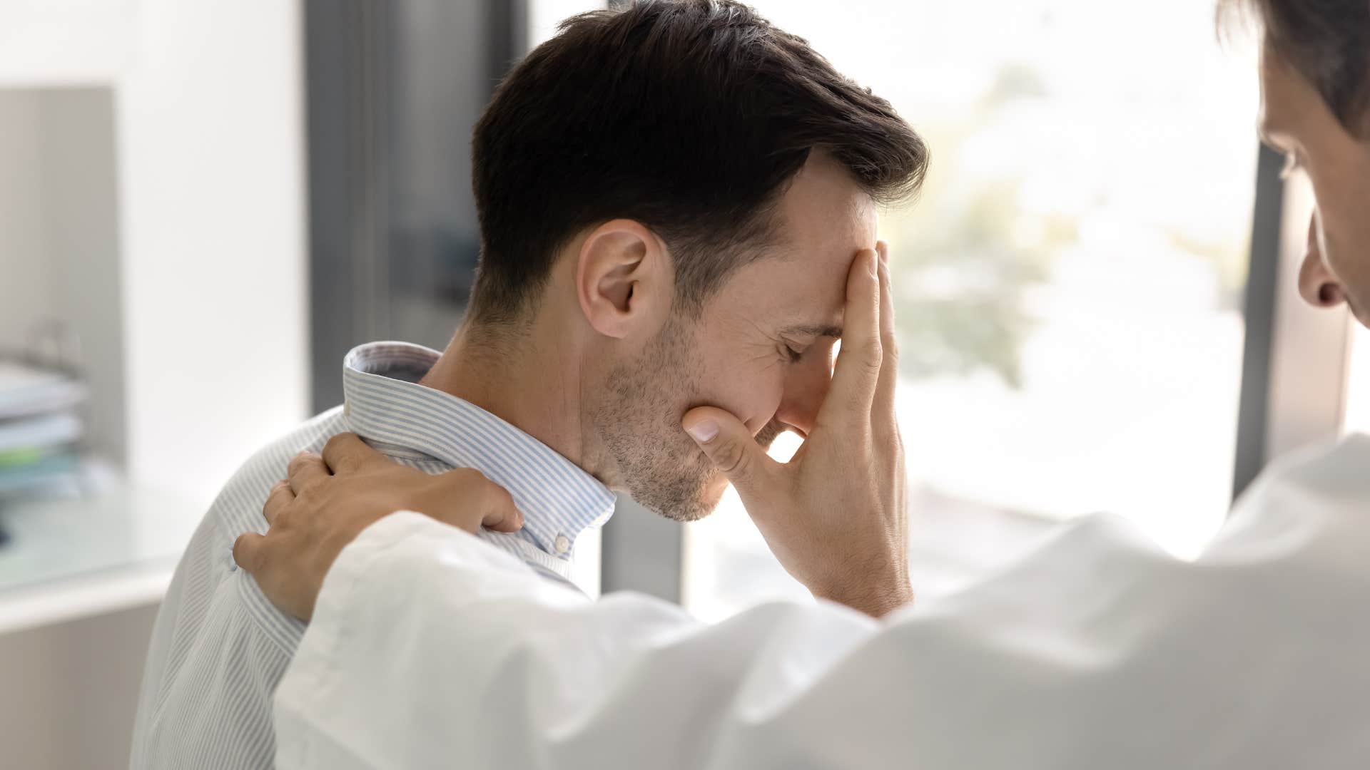 Man saying "I'm just tired" to his concerned friend.