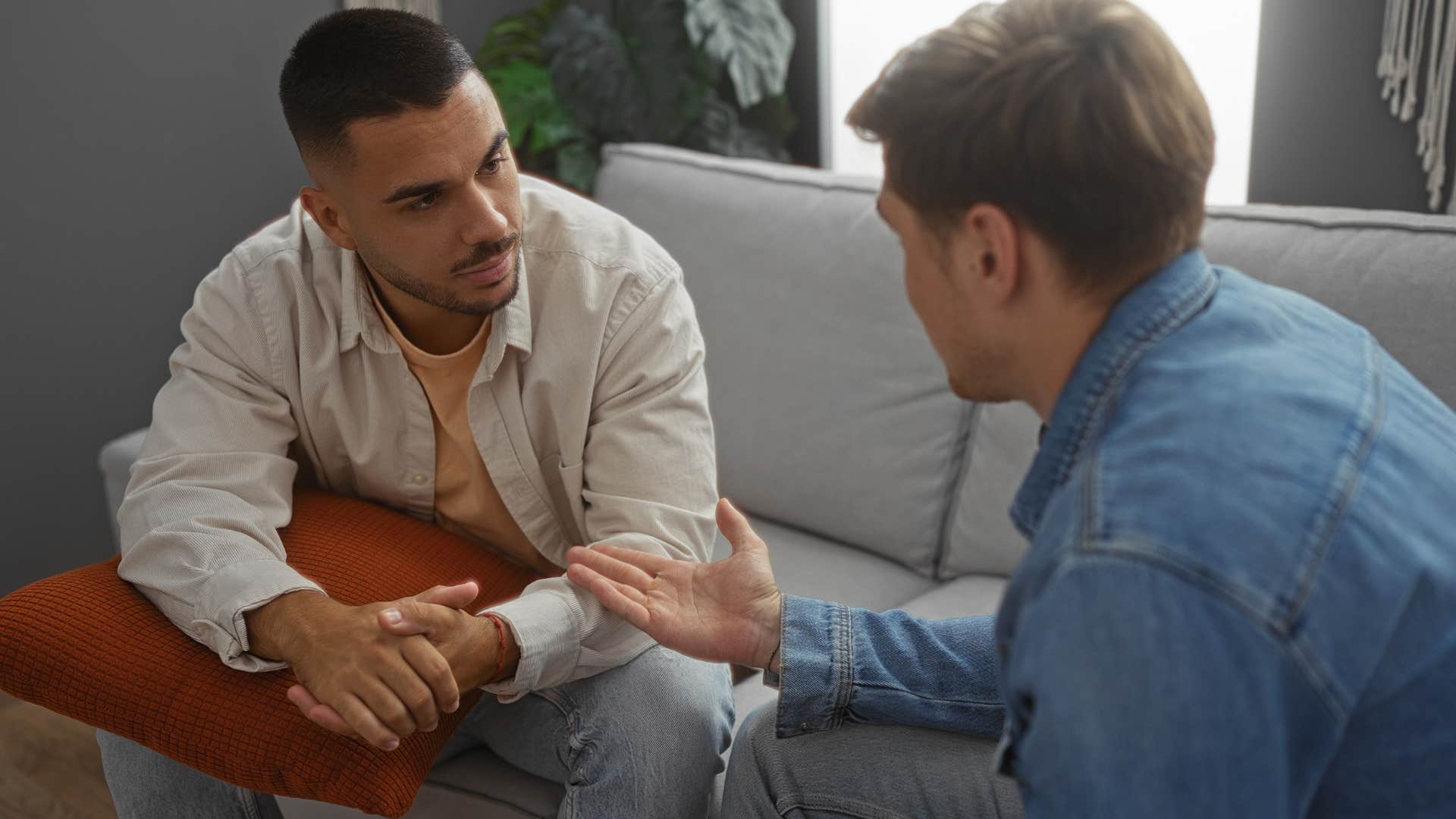 Man saying "we don't fight in front of the kids" to his friend.