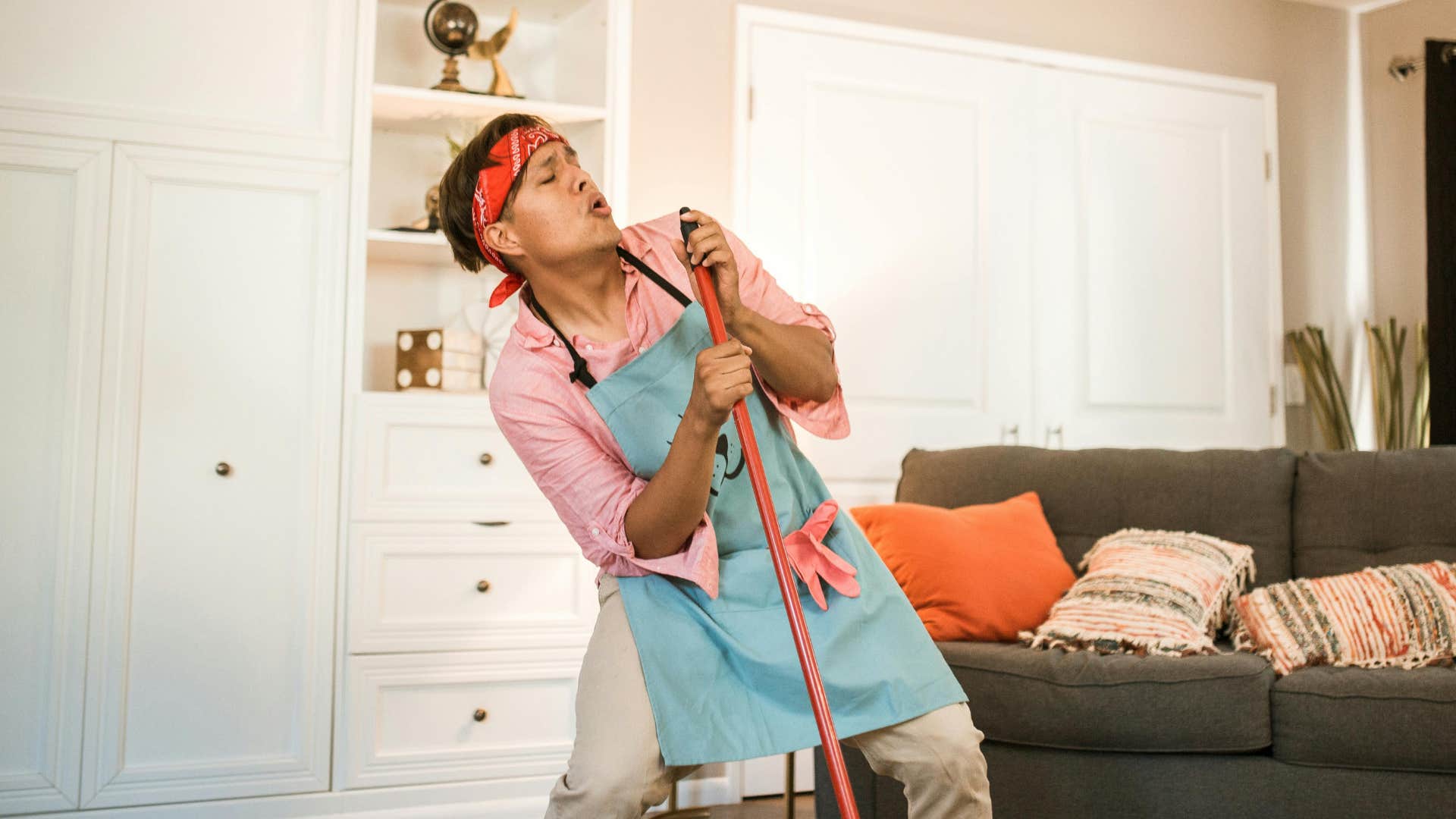 man cleaning his home
