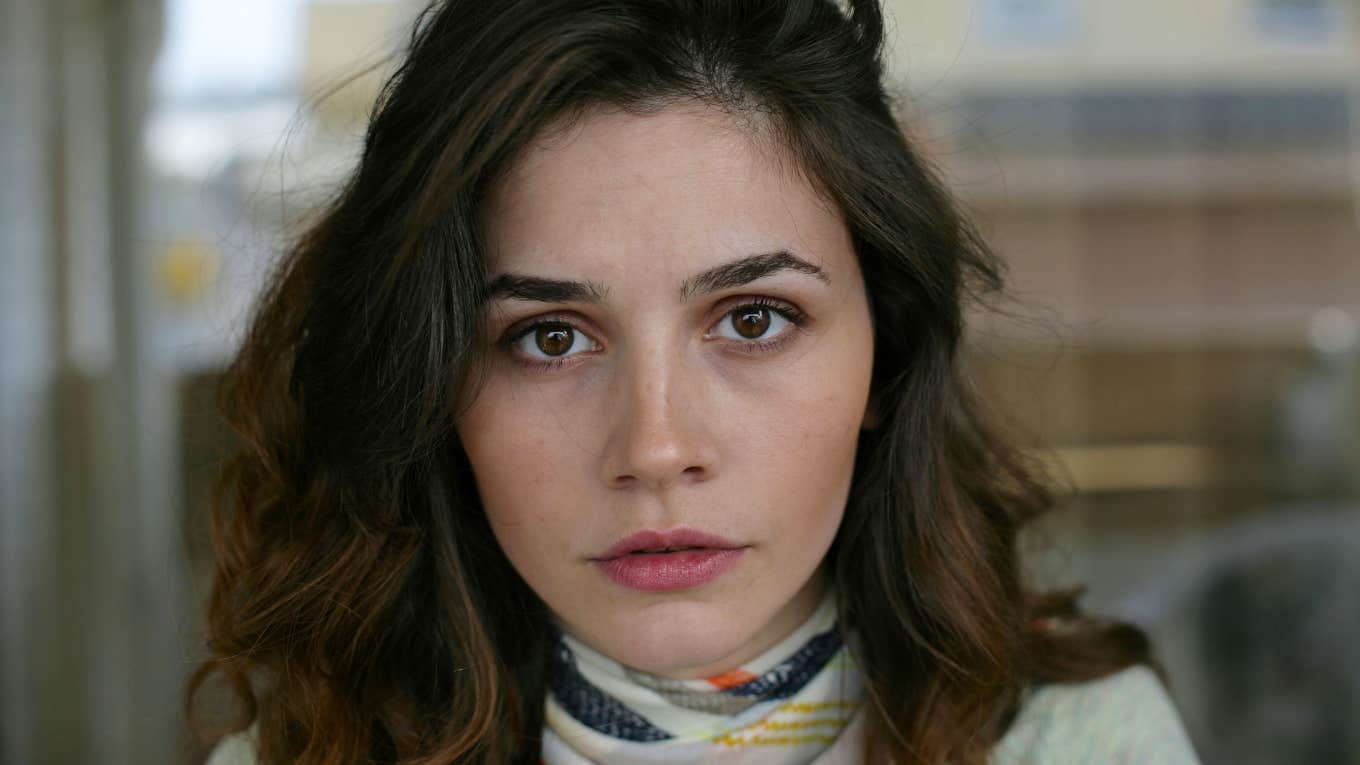 millennial woman looking frustrated about modern problems