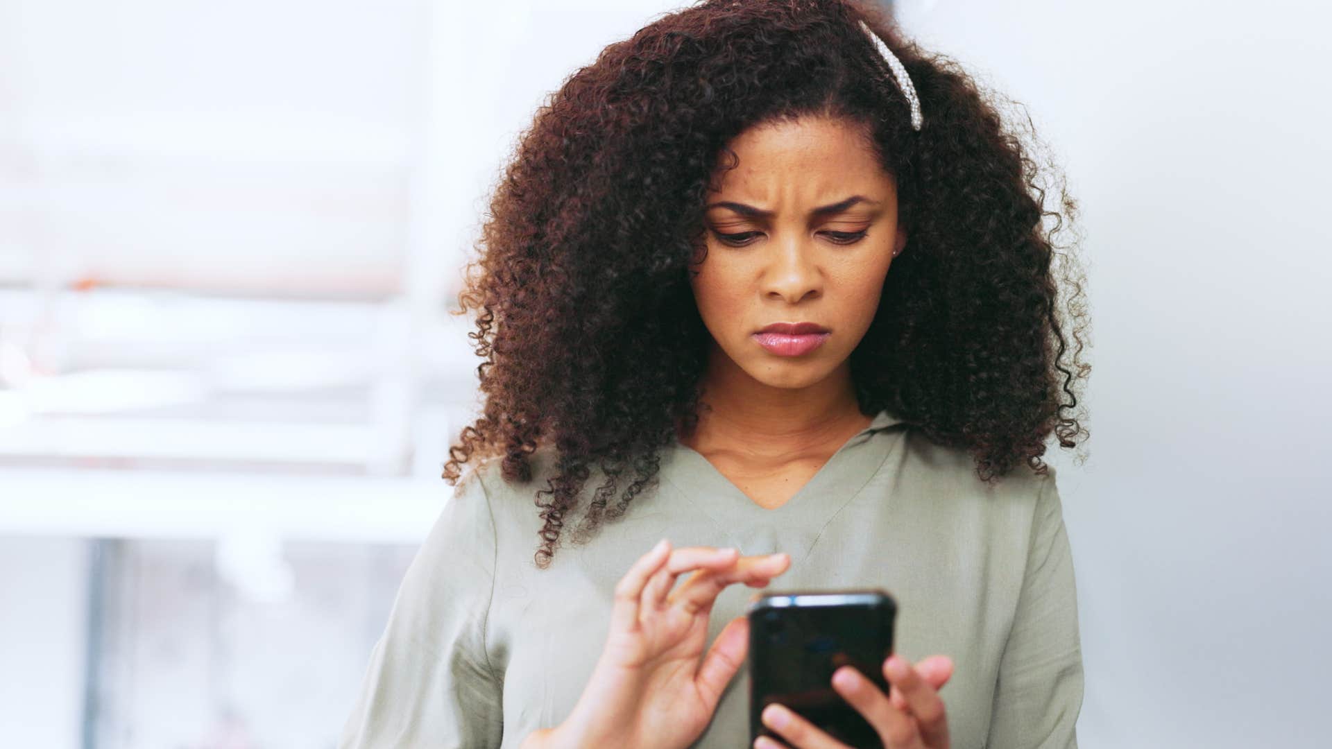 millennial woman on her phone realizing everything is political
