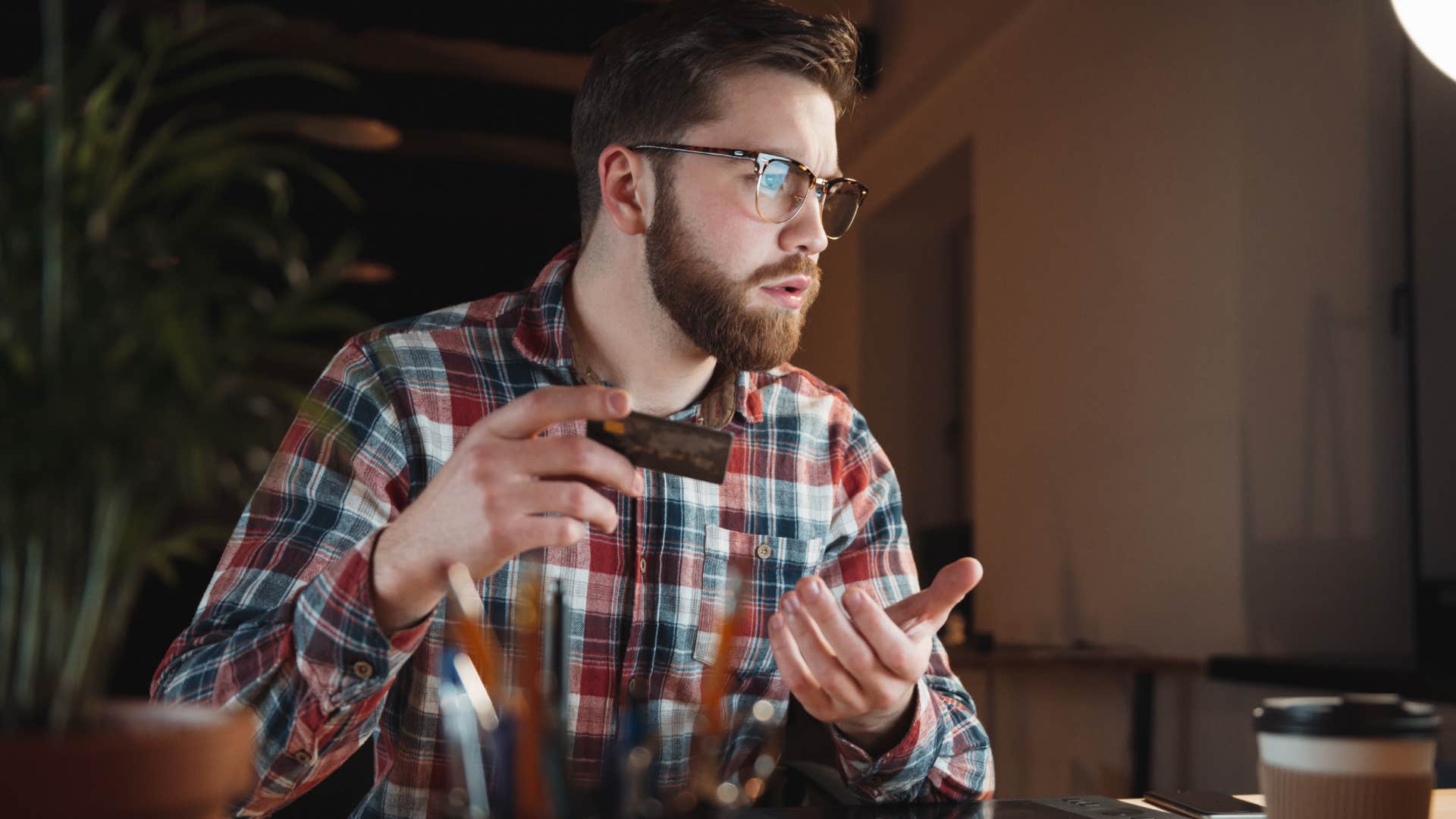 millennial man annoyed that everything requires a subscription while buying things online