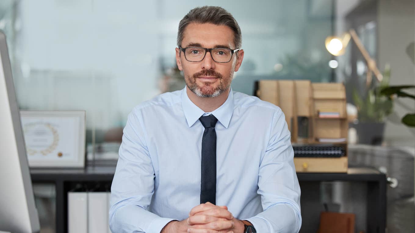 businessman sitting at desk for interview