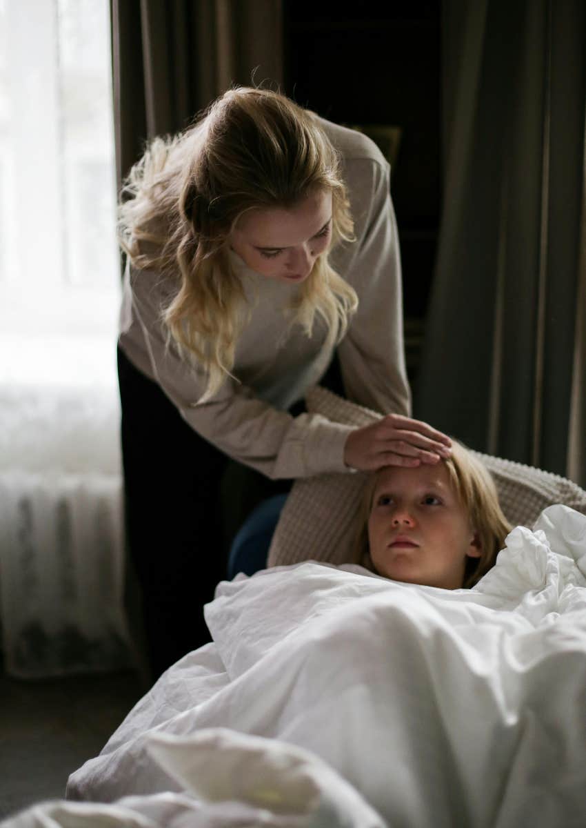mom checking in on her sick son who stayed home from school