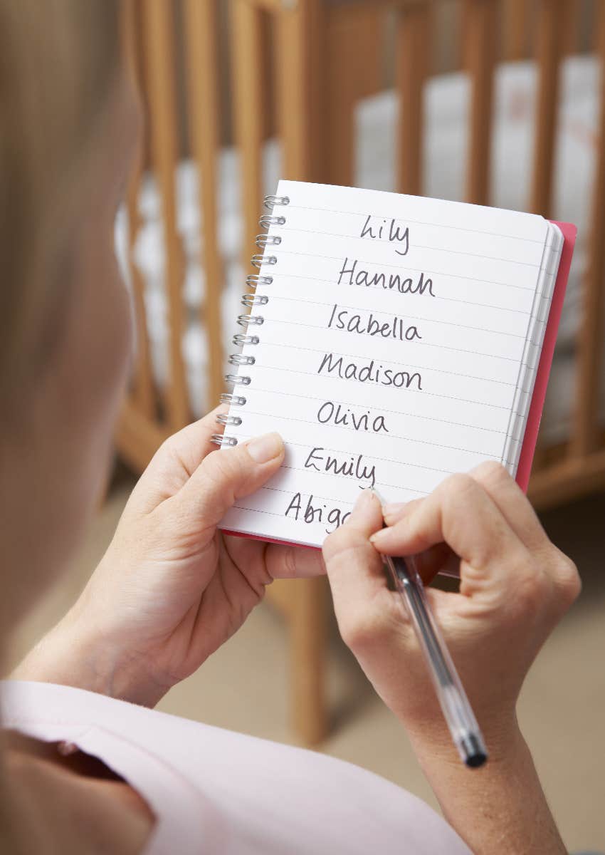 pregnant mom making list of baby names