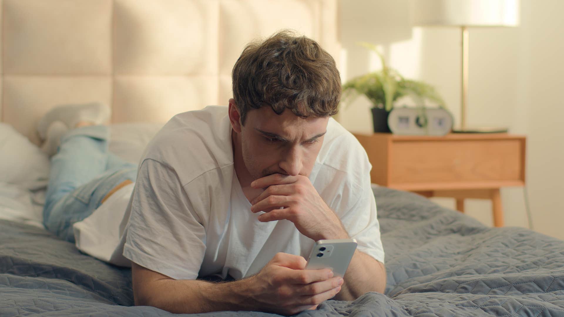 insecure man thinking his friends are mad at him texting