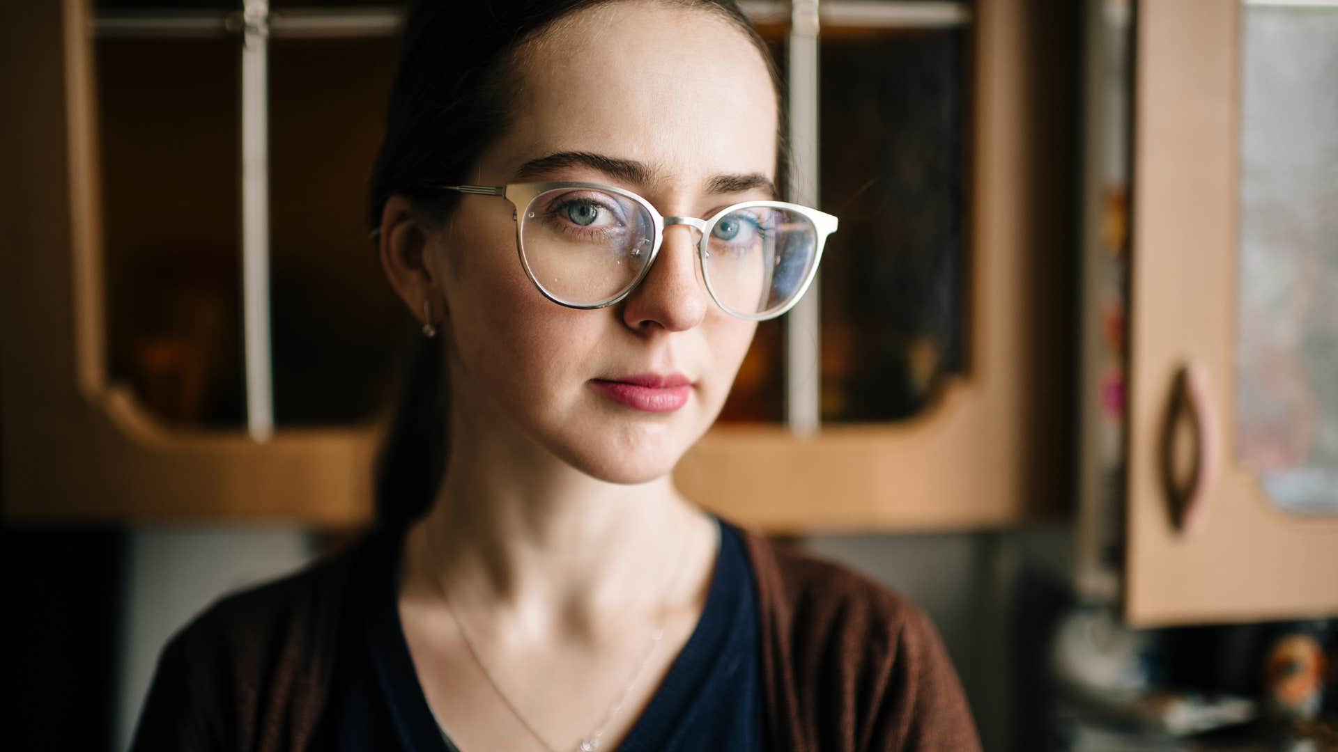 woman who blinks more often than usual looking stressed