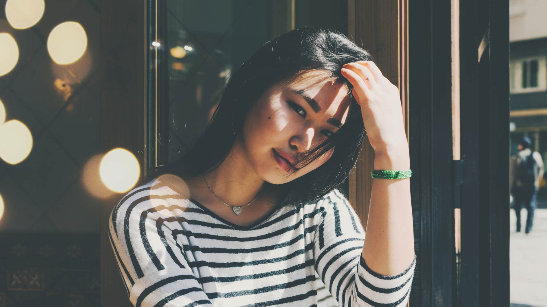 woman fidgeting with her hair