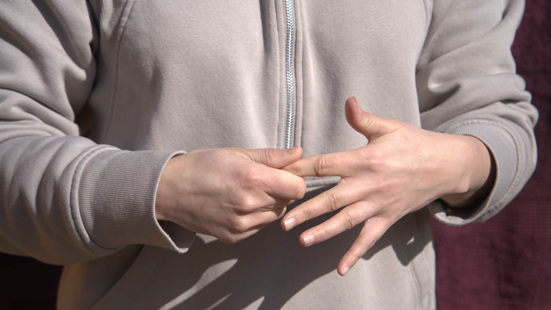 restless person fidgeting with their hands