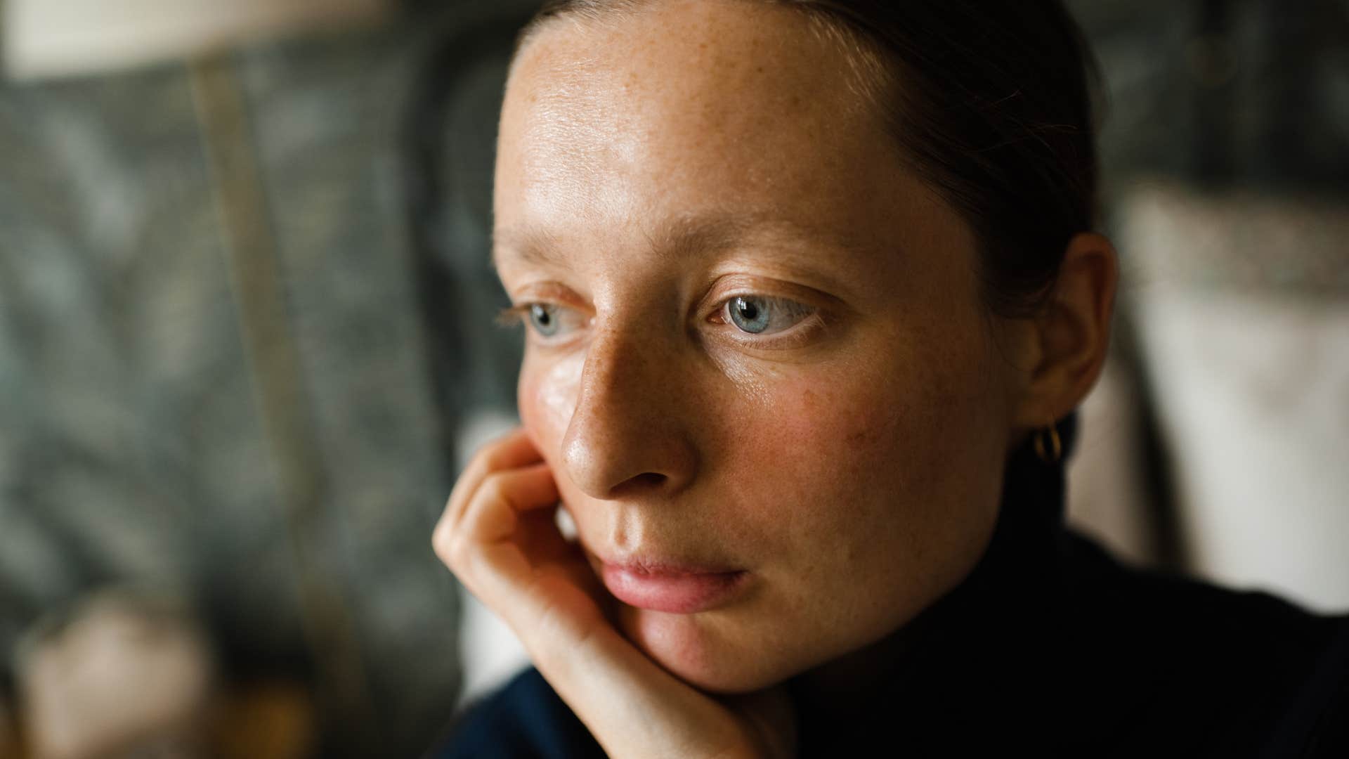 pale woman looking stressed