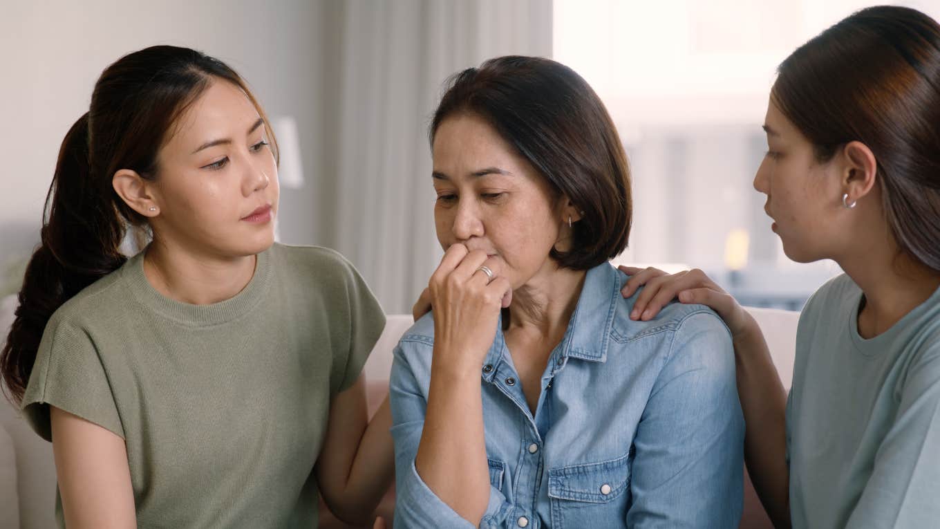 daughters concerned about their mom comforting her