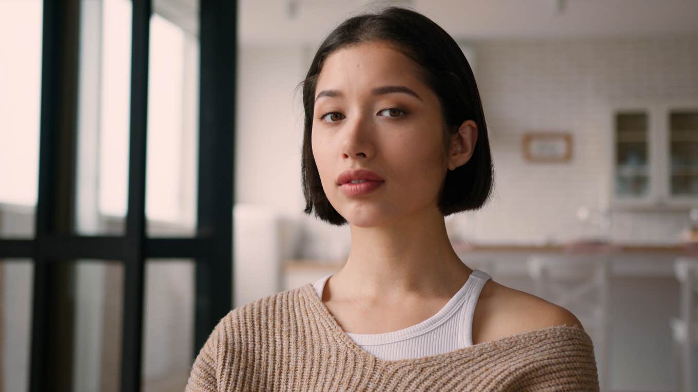 woman standing in her home after growing up broke