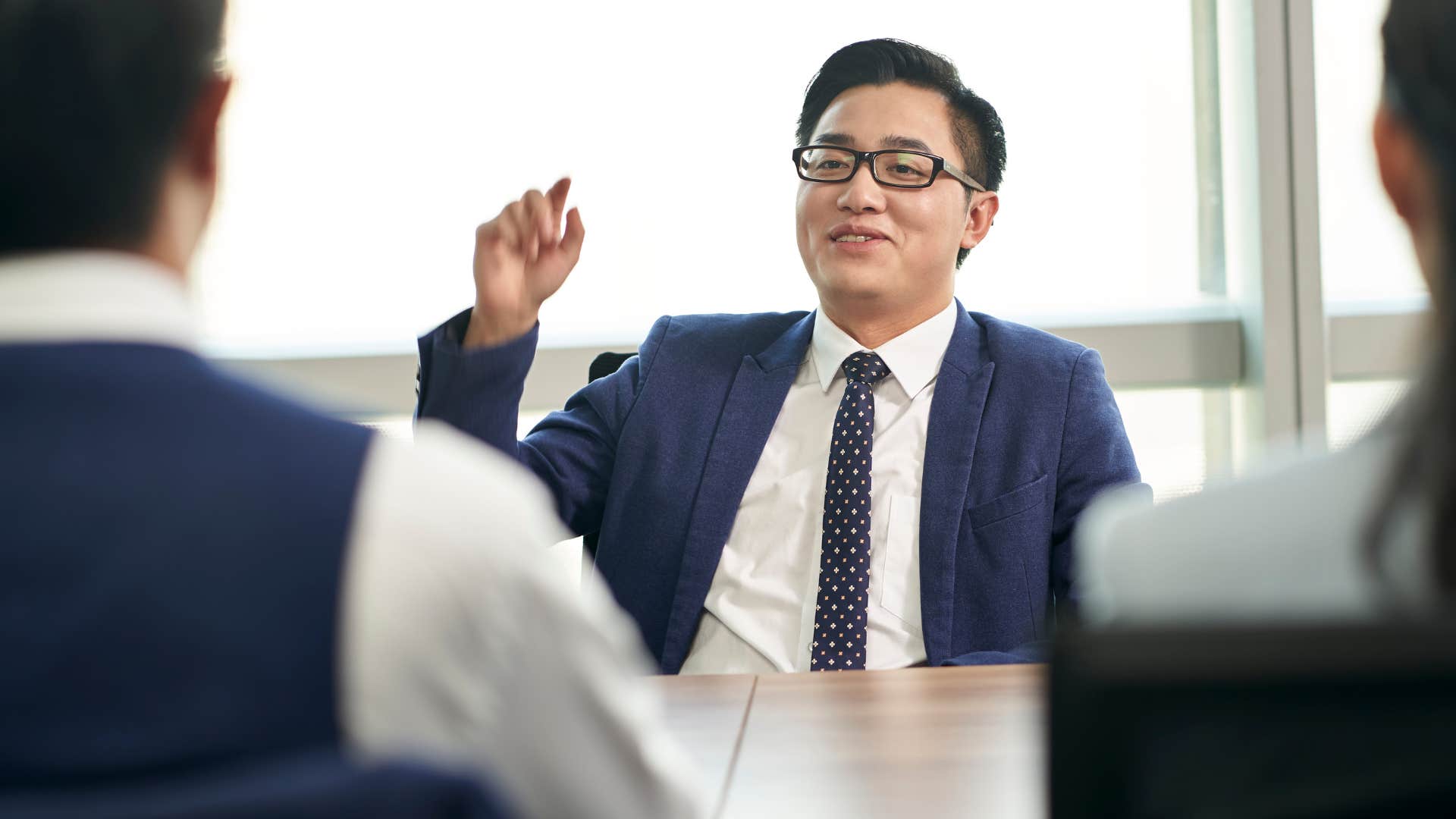 man name-dropping for attention at work