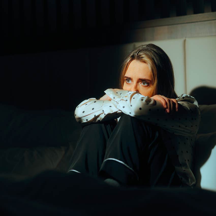 woman who is still heartbroken over someone as she refuses to go out with friends