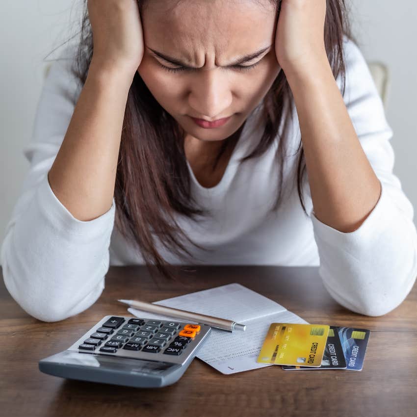 woman stressed over credit card debt