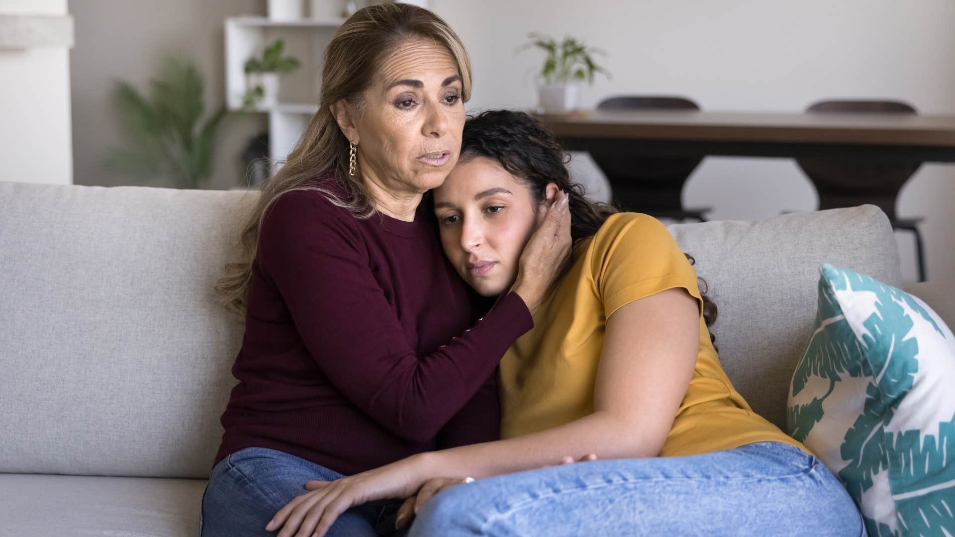 woman who misses her old parenting identity hugging her adult daughter