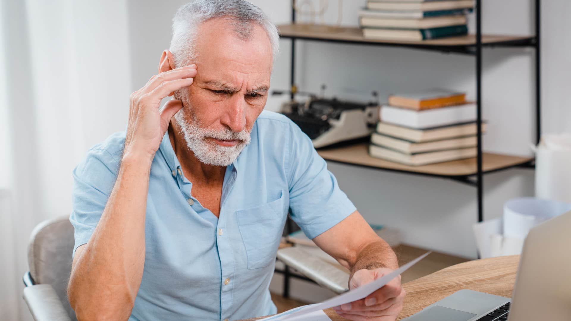older man looking at proof he did a good job parenting